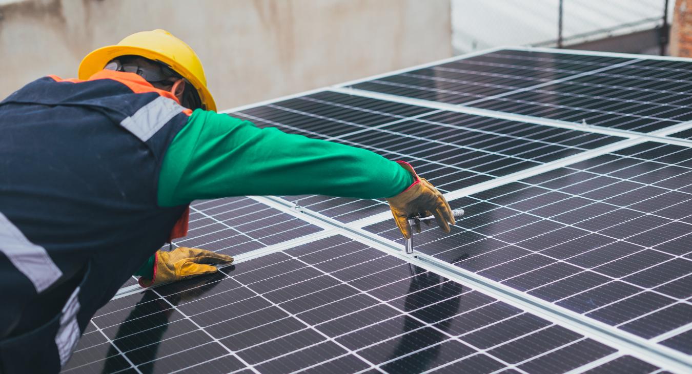 Electrician installing solar PV panels